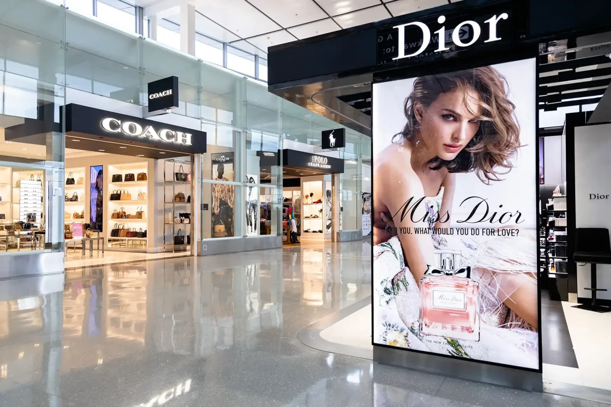 Coach storefront and Dior vendor inside Dulles International Airport in Dulles, VA